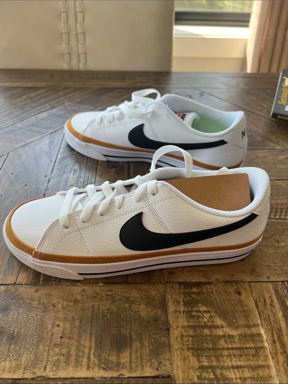 Nike Women’s White Sneakers with Black Swoosh and Tan Trim